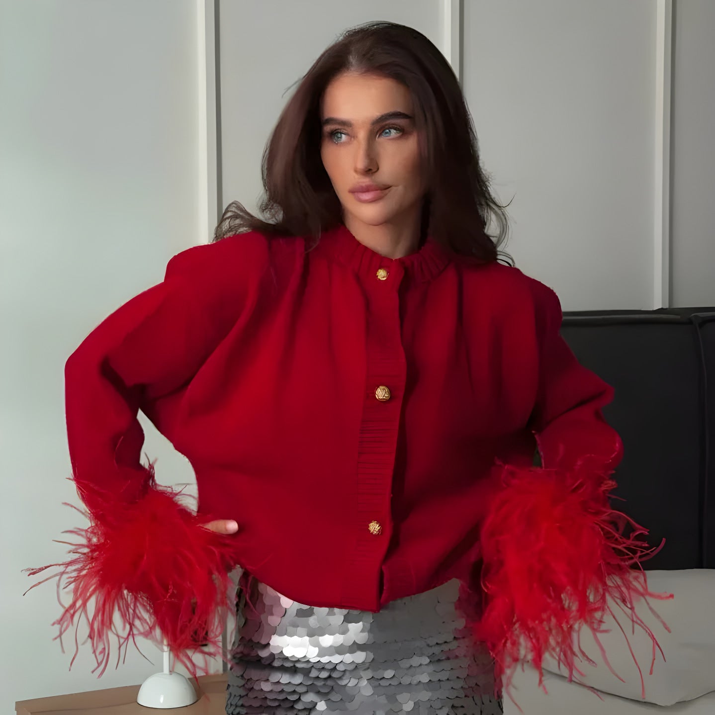 cardigan in maglia con dettagli di piume