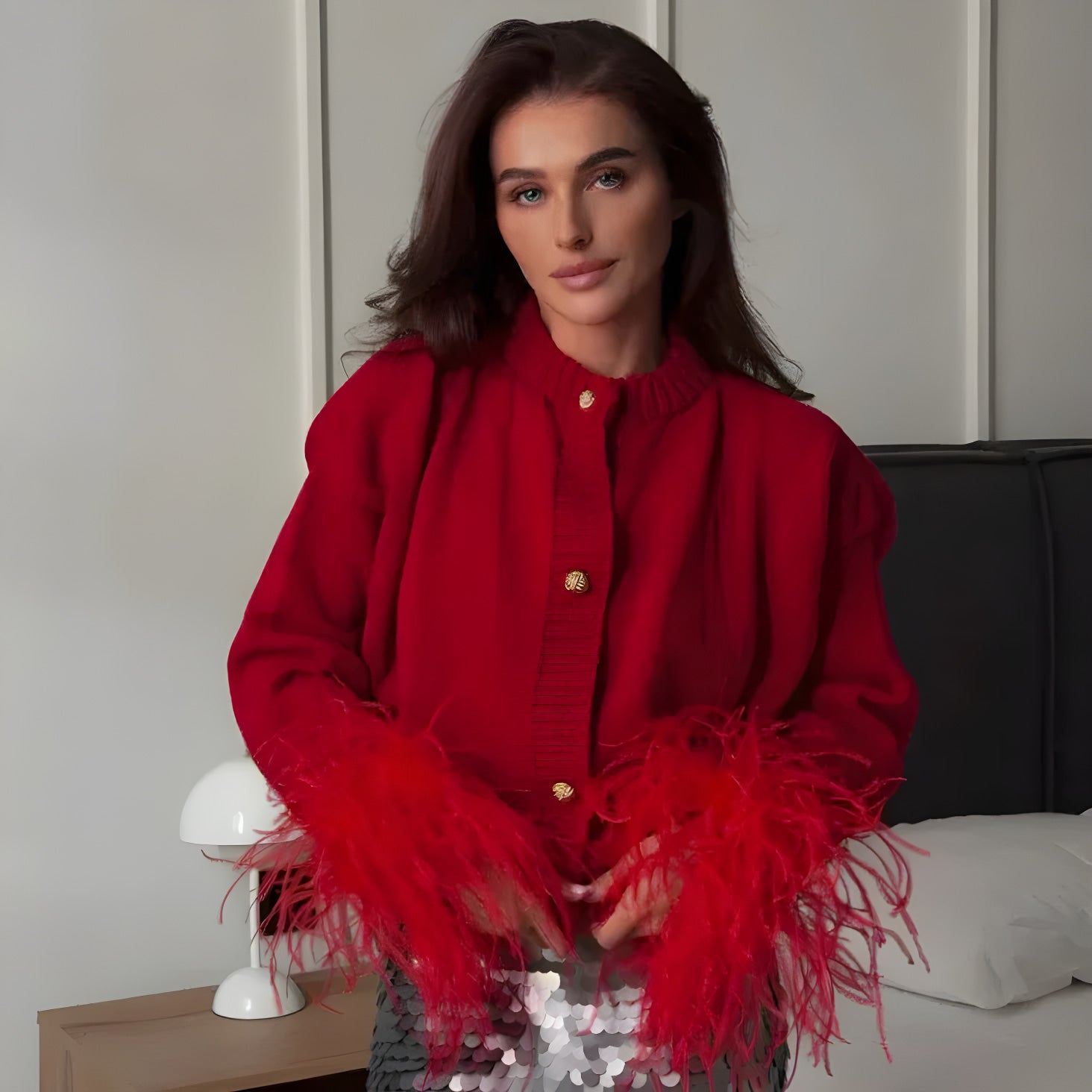 cardigan in maglia con dettagli di piume